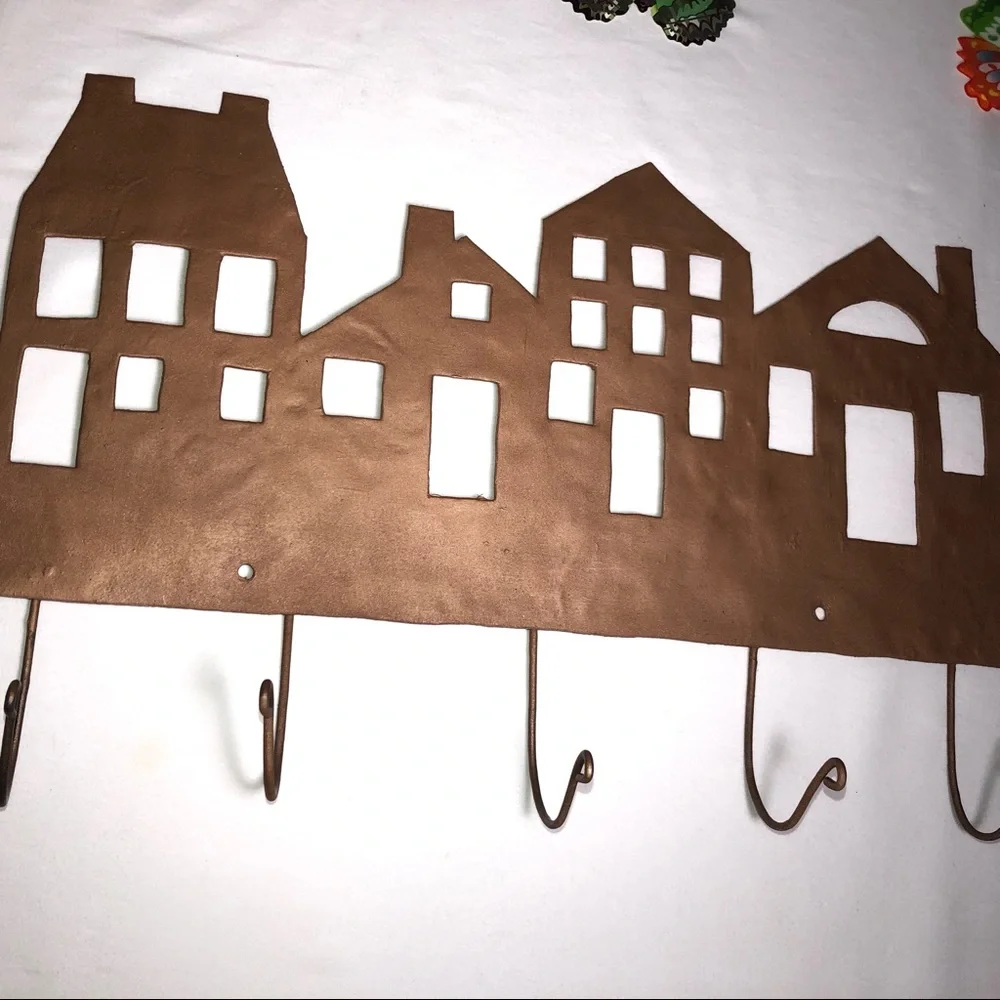Copper painted metal house wall hanger with hooks, pre-owned